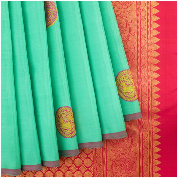 Sea green kanchipuram silk saree with Contrasting red border and cirle Motifs